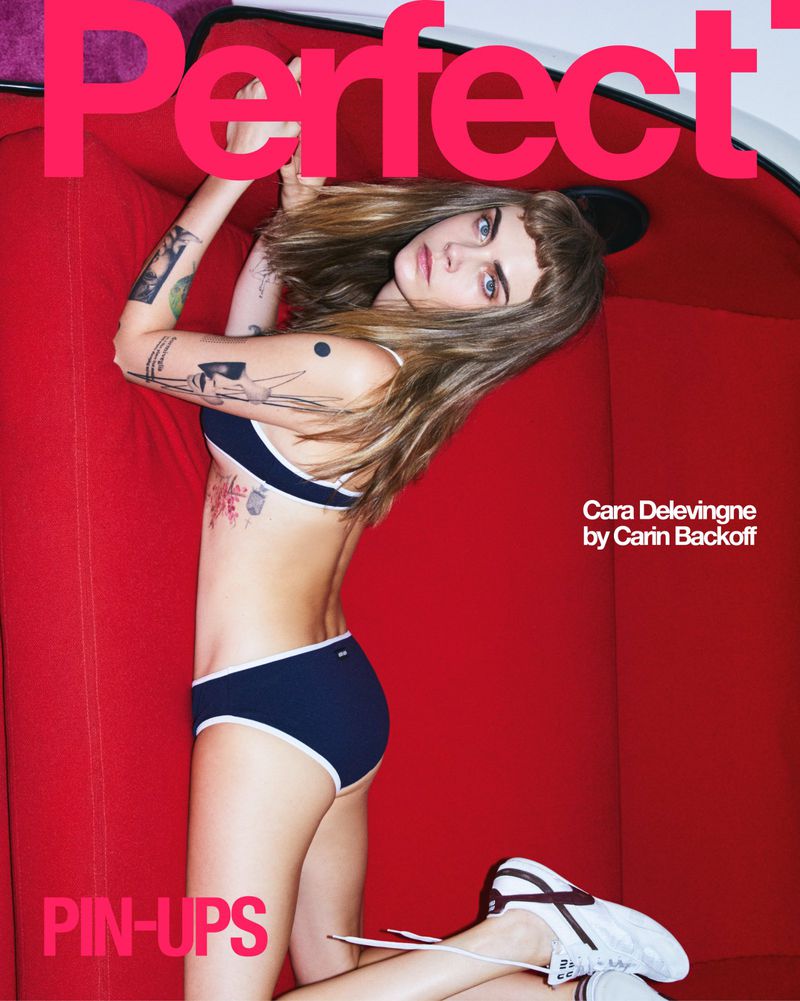 Fashion editorial featuring Cara Delevingne in a navy bikini and sneakers, posing on a red couch with a 'Perfect' magazine cover background.