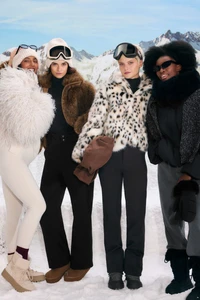 Four female models in winter ski apparel posing outdoors against a snowy mountain backdrop for Oysho.