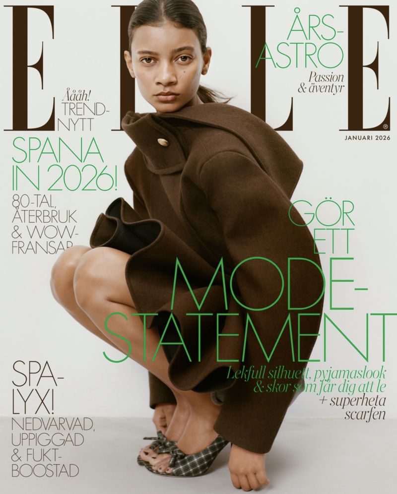 Elle magazine cover featuring a woman in a brown coat and plaid shoes squatting in front of a white backdrop with text overlay.