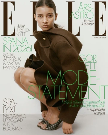 Elle magazine cover featuring a woman in a brown coat and plaid shoes squatting in front of a white backdrop with text overlay.