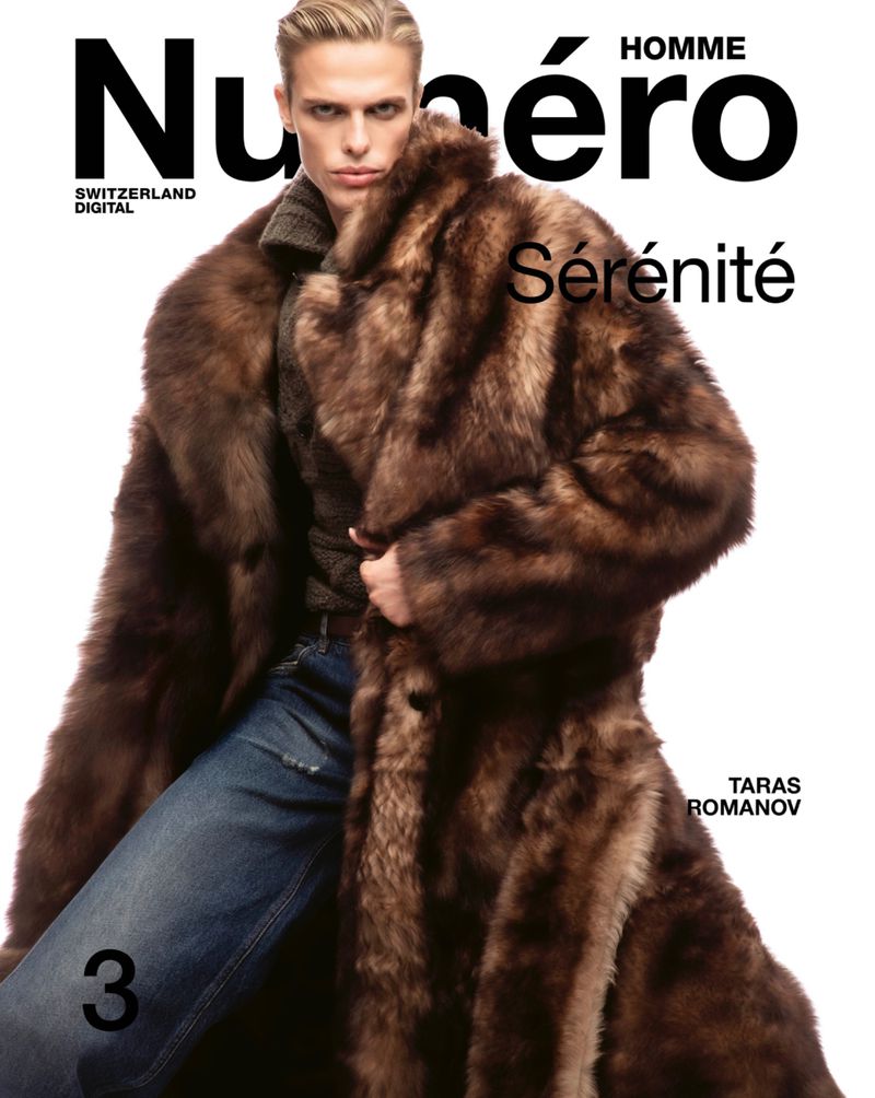 Fashion magazine cover features a blond male model in a fur coat and jeans, posing against a white backdrop, with magazine text overlay.