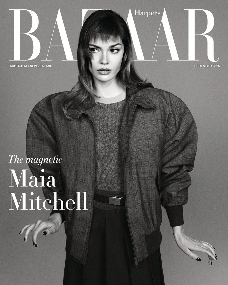 Bazaar magazine cover featuring Maia Mitchell in a grey jacket and sweater against a neutral backdrop, with the magazine's logo prominently displayed.