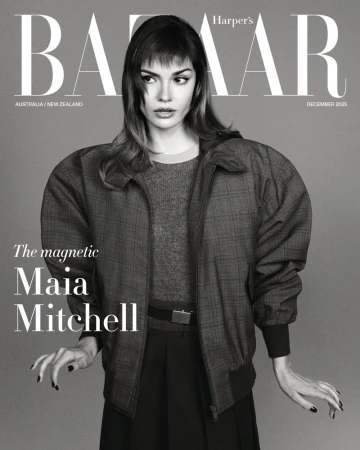 Black and white portrait of Maia Mitchell posing in an oversized plaid bomber jacket on the Harper's Bazaar Australia cover.