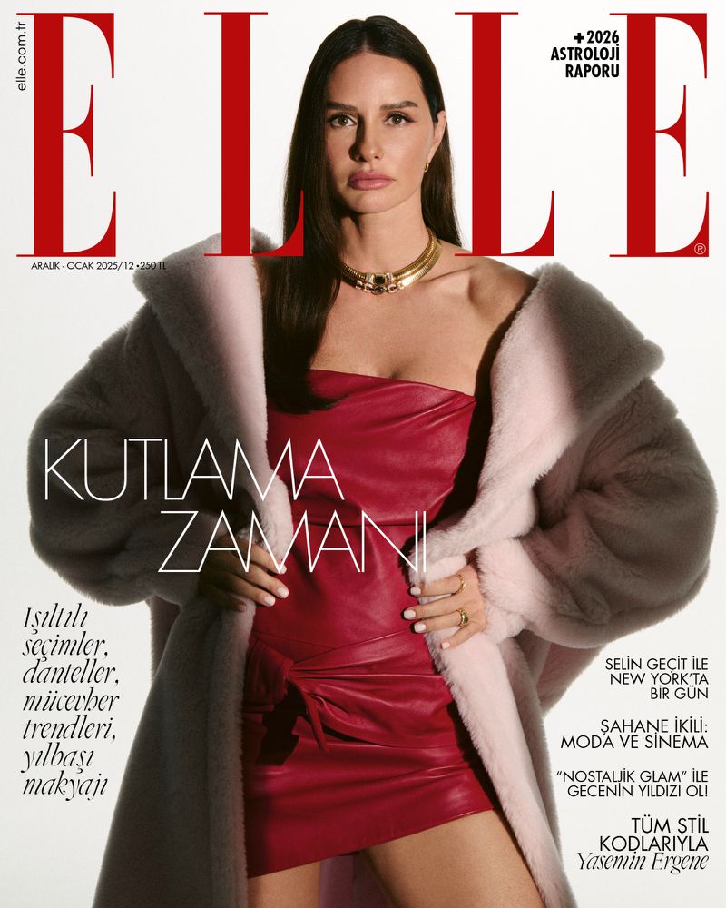 Elle magazine cover featuring a woman in a red dress and light pink fur coat, accessorized with a gold necklace and ring, against a white backdrop.