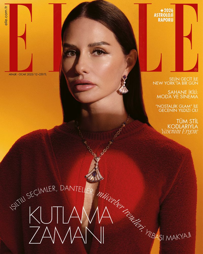 Elle magazine cover featuring a woman with dark hair wearing a red top and jewelry against a yellow background with magazine text.