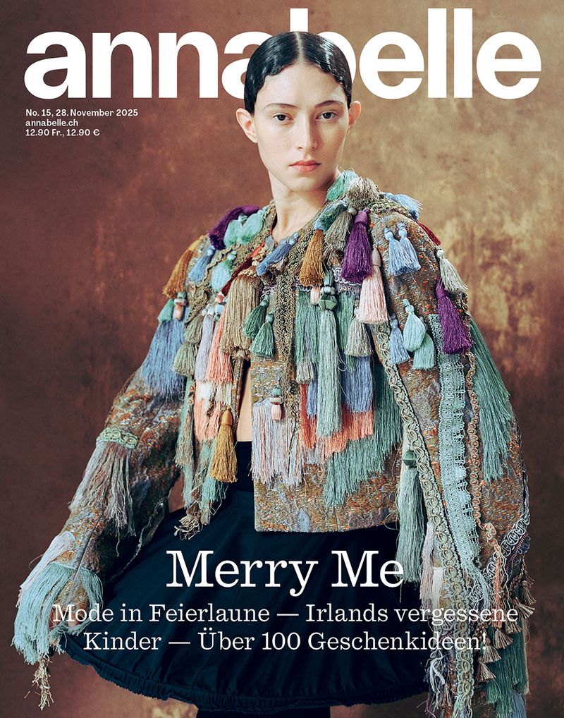 Annabelle magazine cover features a young woman in an embellished jacket with tassels, against a soft brown studio backdrop. Fashion editorial.