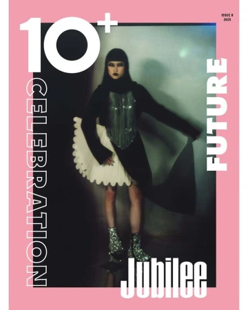 Fashion magazine cover featuring a stylish woman in a black outfit with a silver top and sparkly boots, set against a silver background.