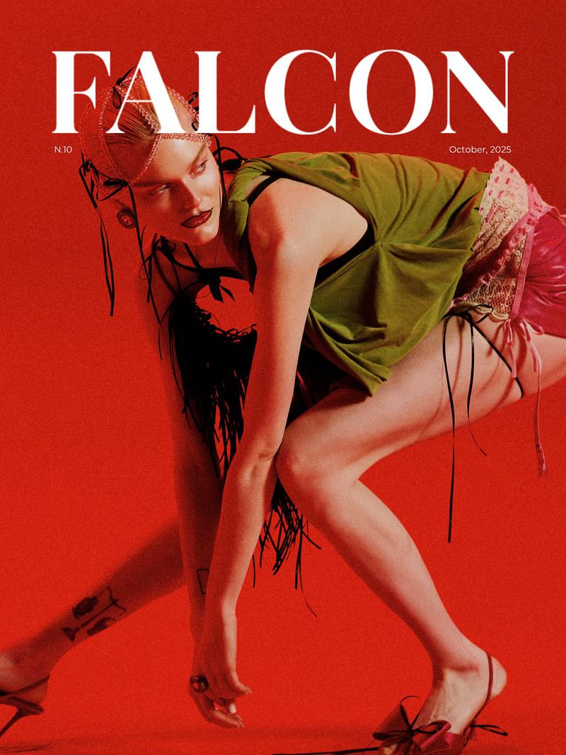 Magazine cover featuring an adult female model posing in green top and red bottoms on red background for Falcon Magazine's October 2025 issue.