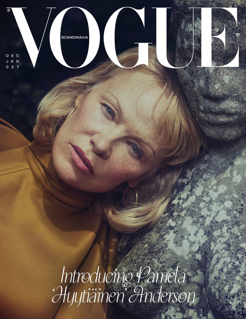 Vogue Scandinavia cover featuring a blonde adult woman with gold hoop earrings. She rests her head against a stone statue.