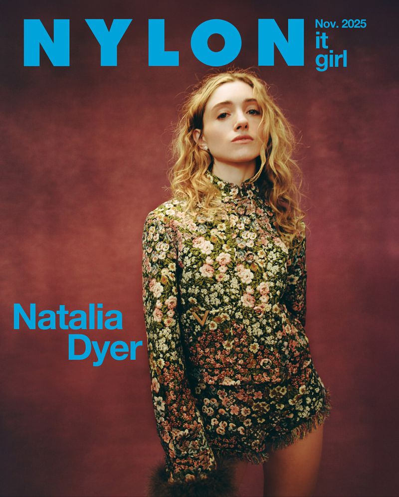 Nylon magazine cover featuring model Natalia Dyer in a floral outfit against a muted background, magazine text: NYLON, Natalia Dyer, It Girl.