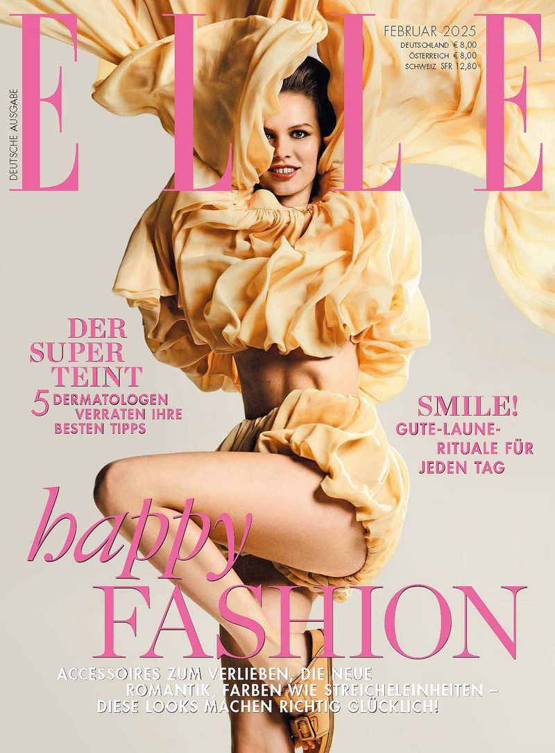 Elle magazine cover featuring a blonde adult female in a flowing tan dress, posing against a neutral background with bright studio lighting.