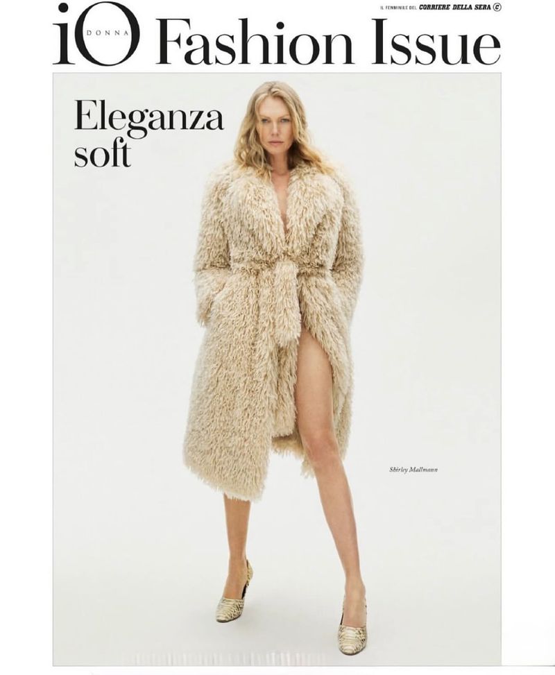 Fashion magazine cover featuring a blonde woman in a faux fur coat and gold heels against a white backdrop, promoting 'IO Donna Fashion Issue'.