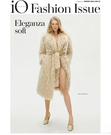 Fashion magazine cover featuring a blonde woman in a faux fur coat and gold heels against a white backdrop, promoting 'IO Donna Fashion Issue'.