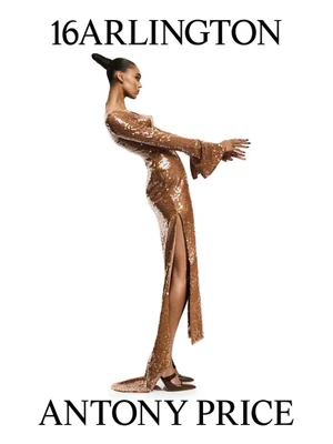 Model in a glittering bronze sequin gown with a thigh slit and long sleeves against a clean white background