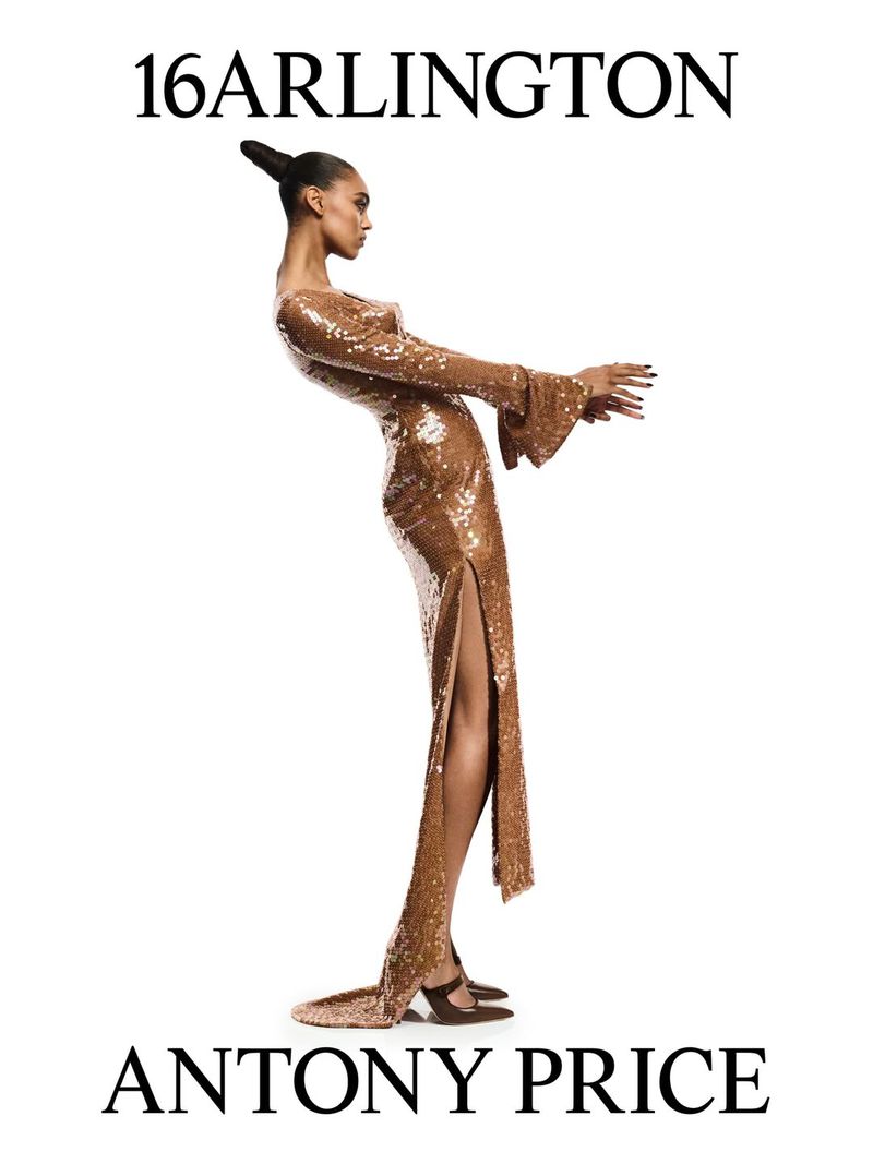Elegant woman in a bronze sequin gown with a side slit poses against a white backdrop, showcasing high fashion design and styling.