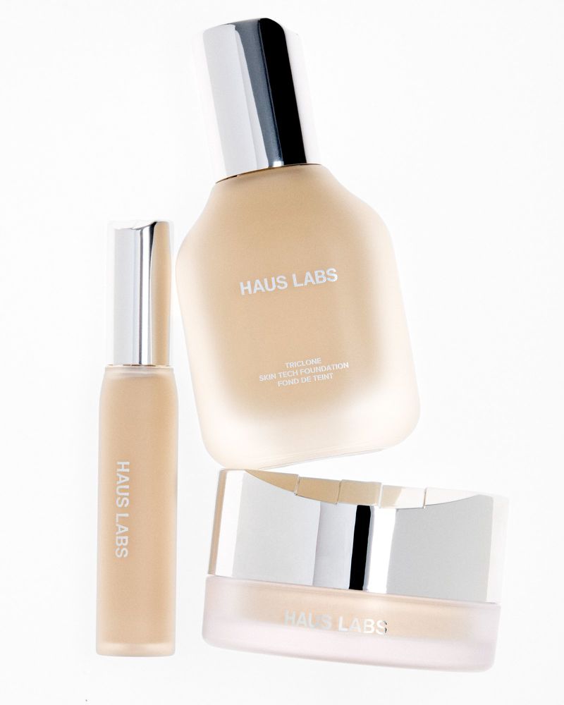 Three Haus Labs makeup products including a liquid foundation, skin tech foundation, and hydrating powder on a white background.