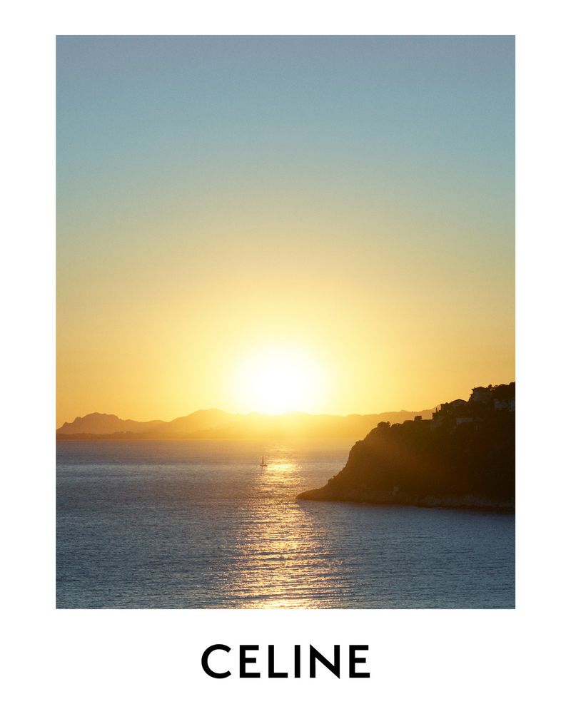 Scenic sunset over the ocean with mountainous islands in the background, creating a serene and picturesque seascape at dusk.