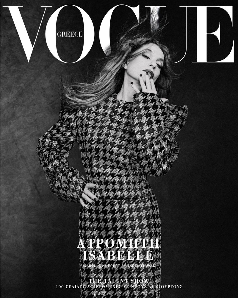 Vogue Greece magazine cover featuring a woman in a houndstooth dress posing against a dark gray background with the magazine's logo.