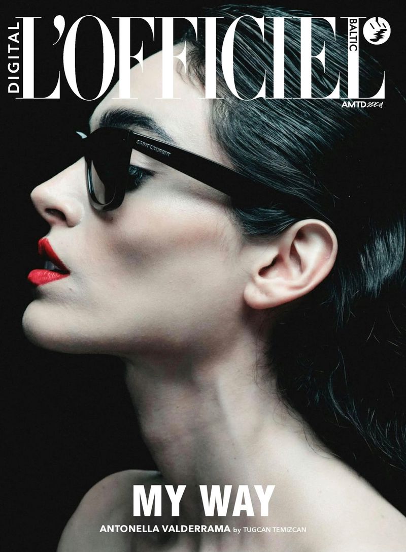 Fashion magazine cover featuring a woman in black sunglasses and red lipstick against a dark backdrop, showcasing beauty and style.