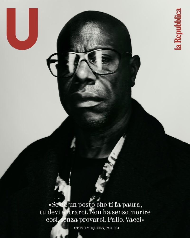 Monochromatic portrait of an adult male with glasses on a magazine cover, featuring large, bold typography and quote.