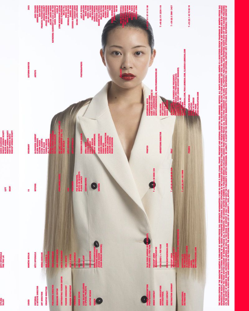 Asian woman in a cream double-breasted blazer with ombre hair posing against a white background with superimposed pink text.