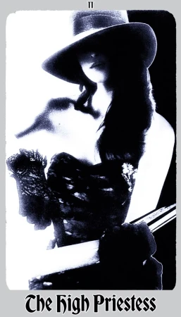Monochrome portrait of a woman wearing a wide-brimmed hat, styled in a vintage or artistic style, reminiscent of a tarot card illustration.