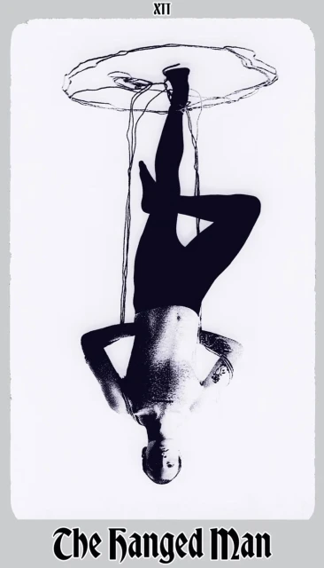 Black and white art of a nude man hanging upside down suspended from above, an artistic rendering with visible text.