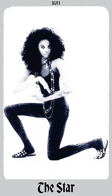 Monochromatic tarot card style image of a woman with afro kneeling and posing with layered necklaces on a light grey background.