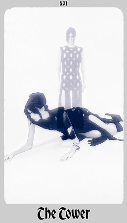 Two women strike poses in a high-fashion editorial shot with cool color grading and a clean white background, evoking a tarot card.
