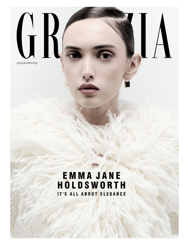 Magazine cover featuring Emma Jane Holdsworth in a feathered white garment against a bright background with 'GRAZIA' at the top.