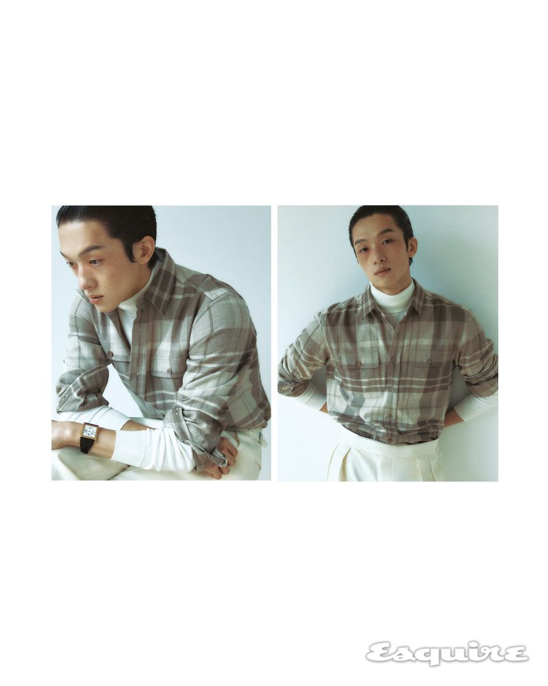 Two portrait views of a young adult male model in a plaid shirt, white turtleneck and white trousers, posing indoors against a white wall.