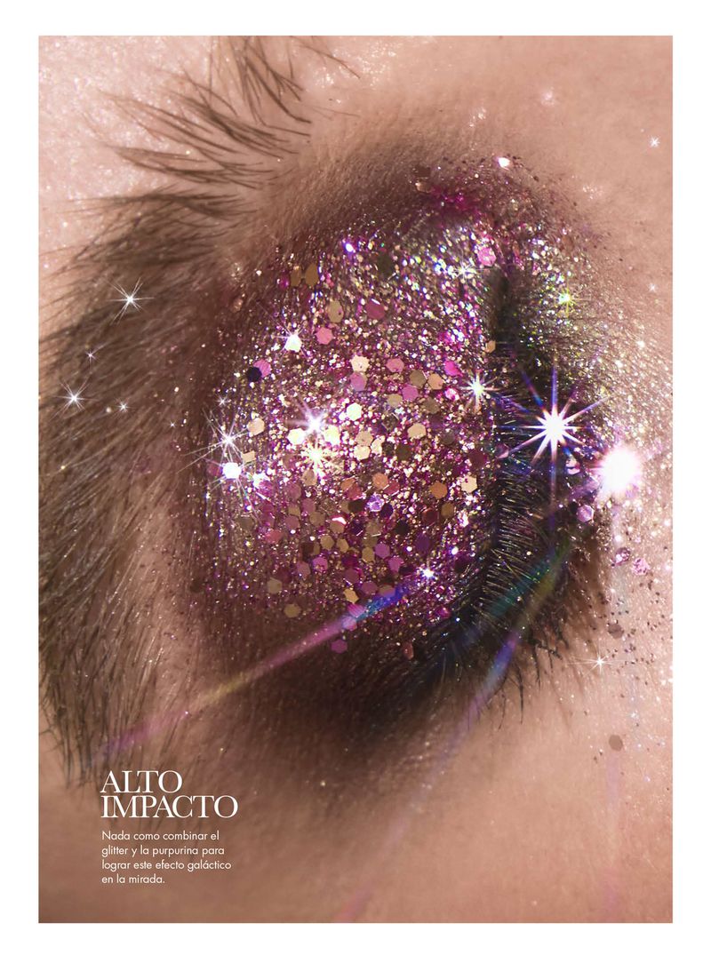 Macro eye closeup with glittery, shimmering purple eye makeup. Cosmetics product shot, fashion and beauty concept.