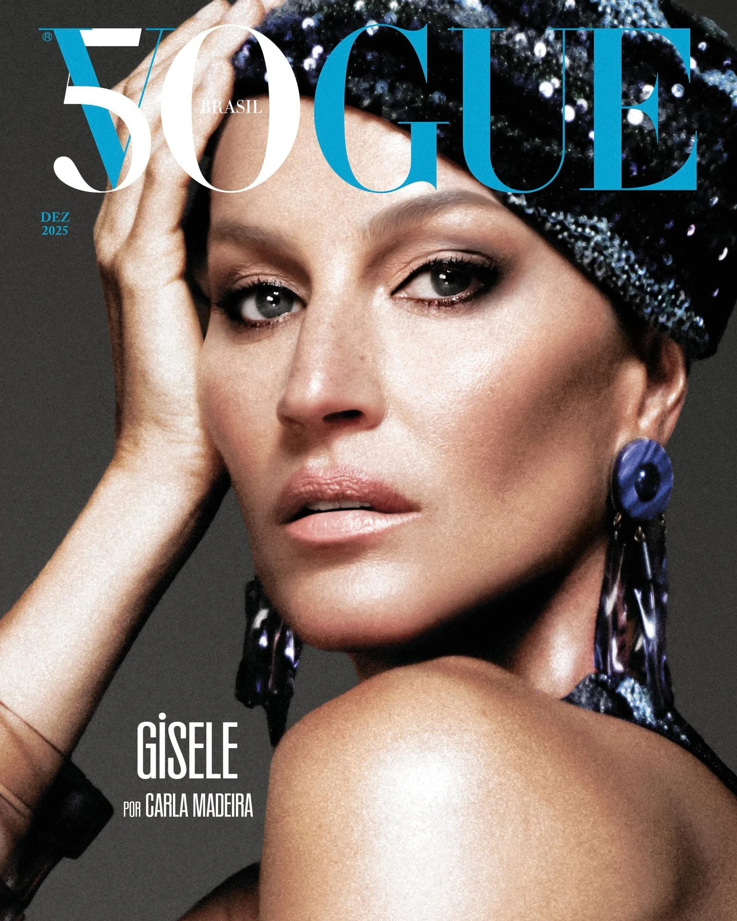 Vogue Brasil cover featuring Gisele Bündchen in a close-up portrait with a patterned headwrap and large earrings, showcasing fashion and beauty.