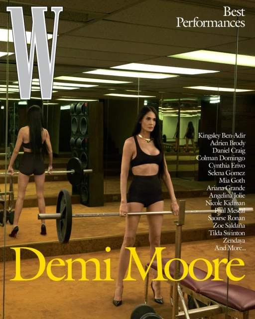 Magazine cover featuring Demi Moore in a gym setting, wearing a workout outfit and heels, posing with barbell weights and equipment.