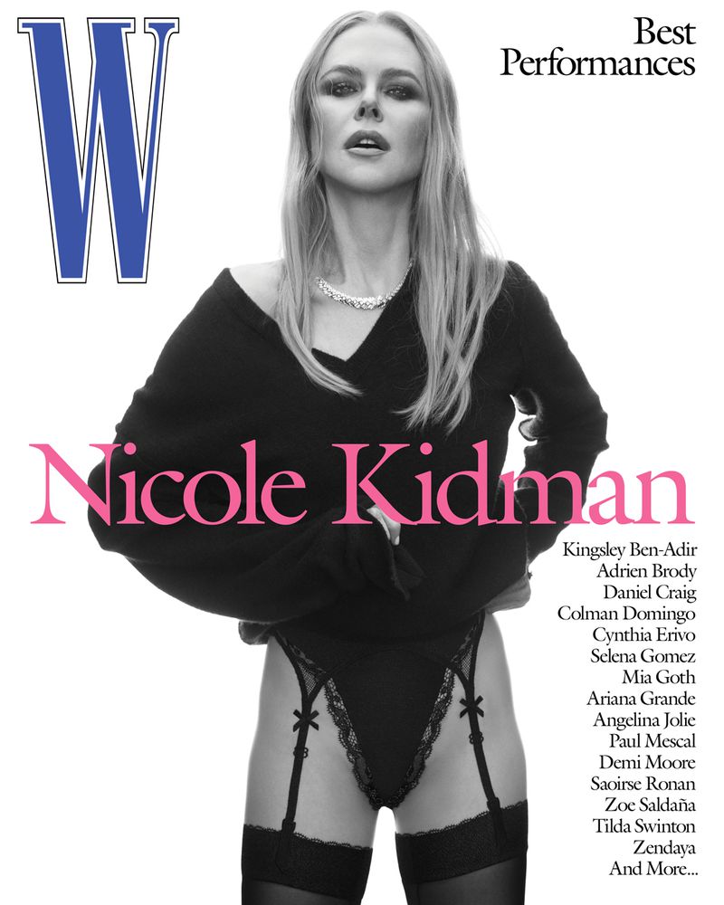 Nicole Kidman posing for a magazine cover wearing a black sweater and black lingerie with suspenders, showcasing fashion and celebrity.