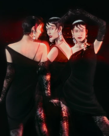 Studio shot of a woman with short hair wearing a black dress, gloves and dangling earrings against a dark background with red light.