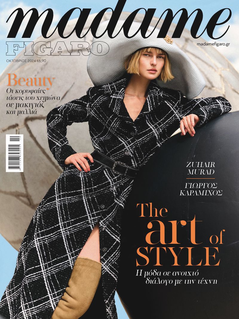 Magazine cover featuring a woman in a patterned coat and hat, standing next to a dark sphere, with the masthead 'Madame Figaro' visible.