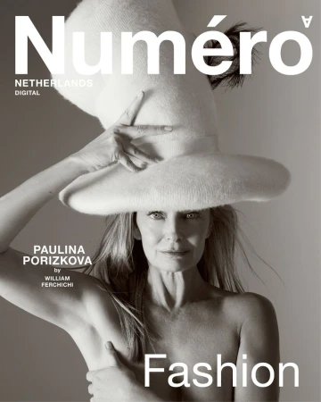 Numero magazine cover featuring Paulina Porizkova wearing a large hat and posing nude, captured in a monochrome fashion editorial shot.