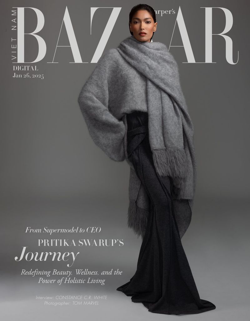 Magazine cover featuring Pritika Swarup in stylish grey knitwear. BAZAAR logo prominent, blending fashion with editorial design and portrait photography.