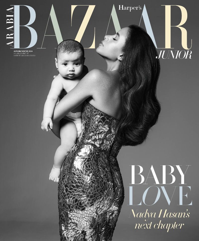 Harper's Bazaar Junior cover featuring an adult female holding a baby. The woman is wearing a strapless dress and posing in a studio.
