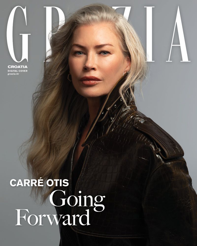 Cropped portrait of Carre Otis on the cover of Grazia Croatia, wearing a brown leather jacket with her long gray hair styled in waves.