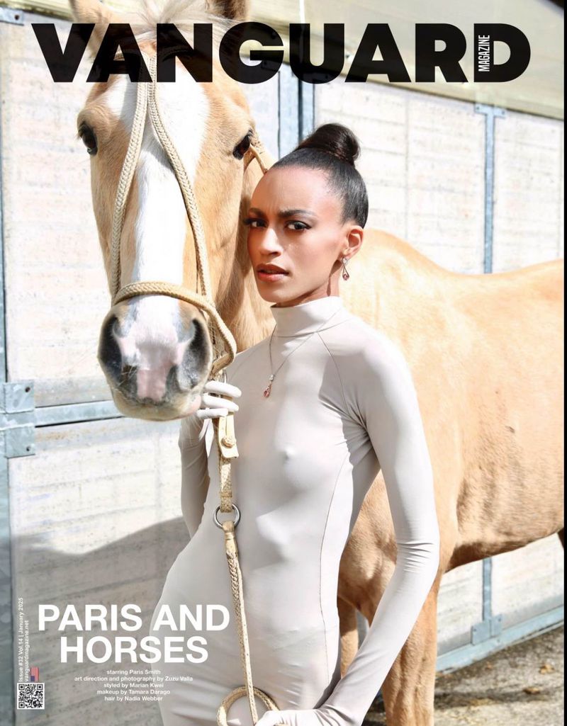 Magazine cover featuring a woman in a bodysuit next to a horse, indoor environment, light skin tone, looking at the camera.