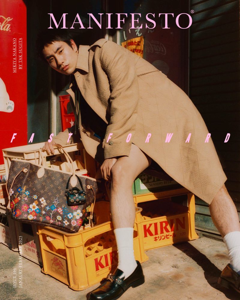 Magazine cover featuring a young Asian adult male in a beige trench coat sitting on yellow crates with a Louis Vuitton handbag.