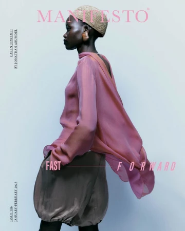 Fashion magazine cover featuring a Black female model in a flowing pink blouse and beige balloon skirt, photographed in profile.