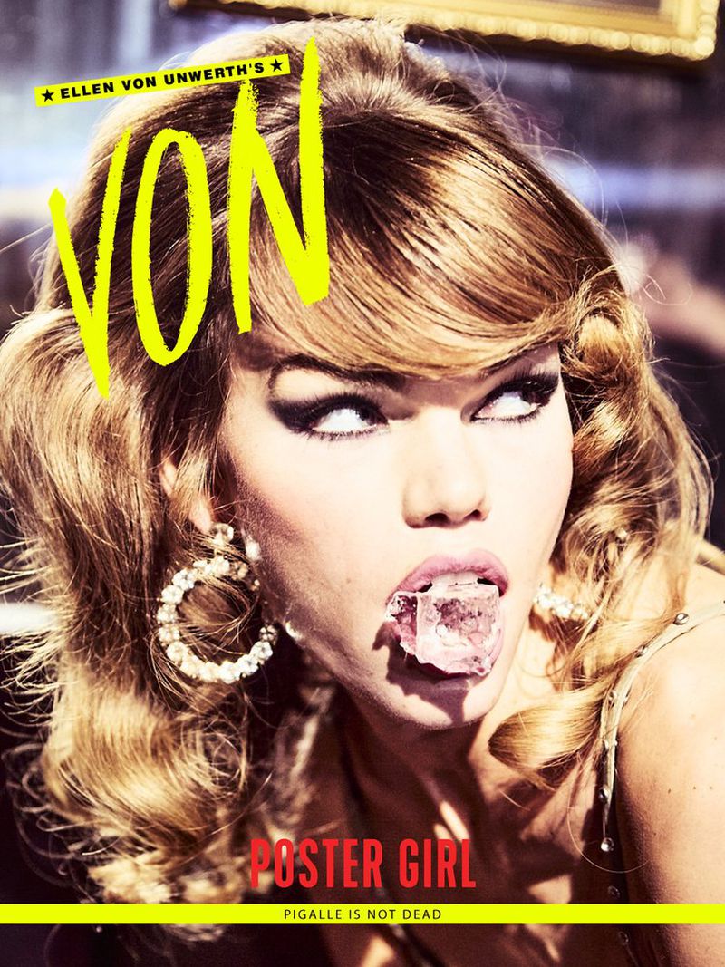 Magazine cover featuring a blonde woman with wavy hair, wearing gold earrings and putting an ice cube in her mouth in a close-up.