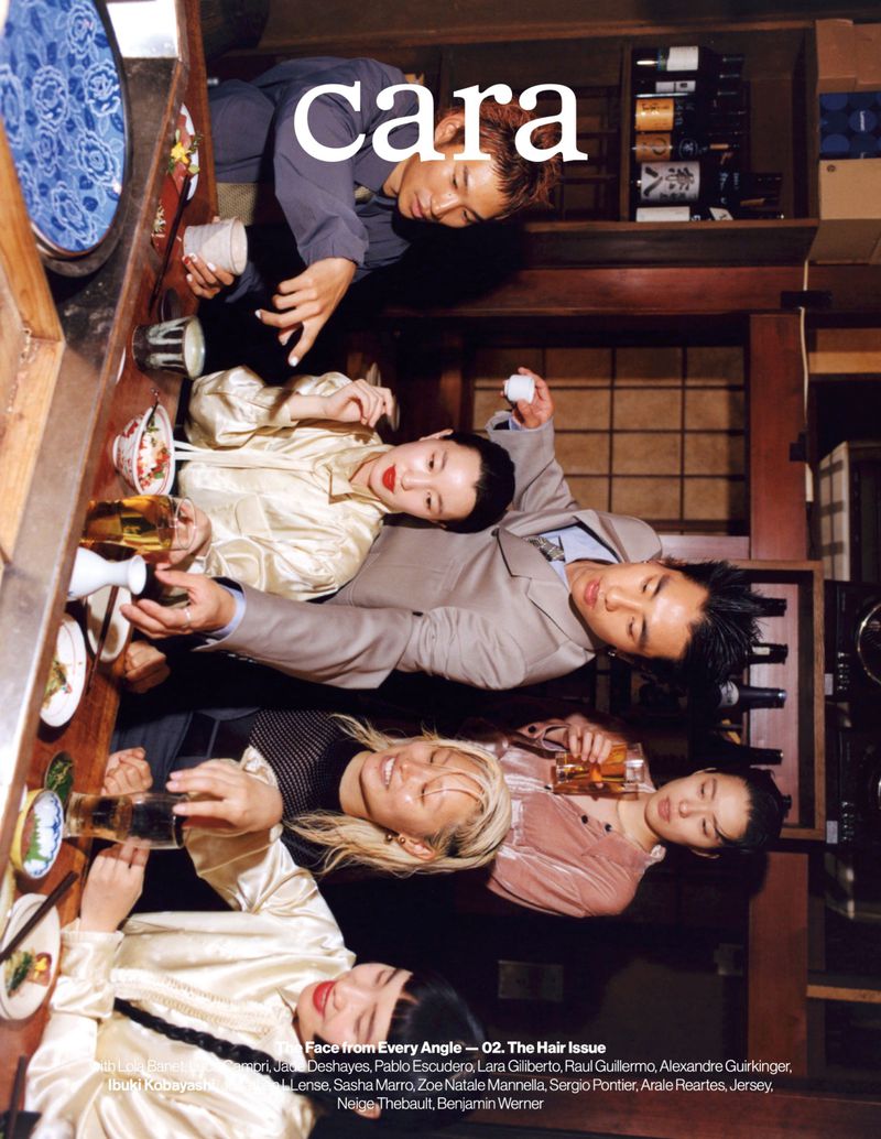 Magazine cover featuring five Asian adult models sitting at a dining table with food and beverages and the title 'Cara' across the top.