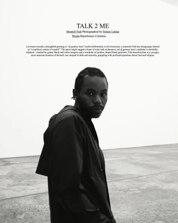 Black and white portrait of a black man wearing a dark jacket in a minimal gallery interior for Love Want.