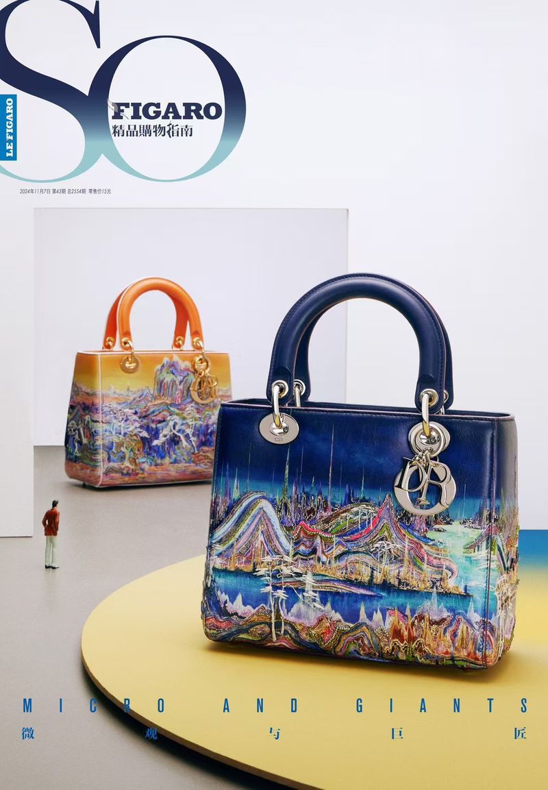 Close-up product shot of two Lady Dior handbags with landscape painting design on a yellow platform on a magazine cover.