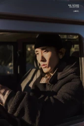 Model Hyuk Kim in a black fleece jacket and beanie sitting inside a car for Lefties A/W 25 campaign photographed by Paolo Steve.