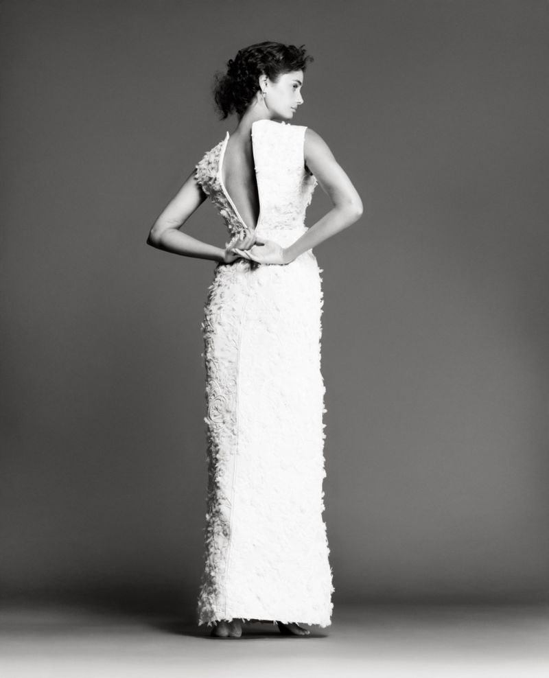 Model Taylor Hill wearing a white textured gown against a grey studio backdrop for Vogue Czechoslovakia.